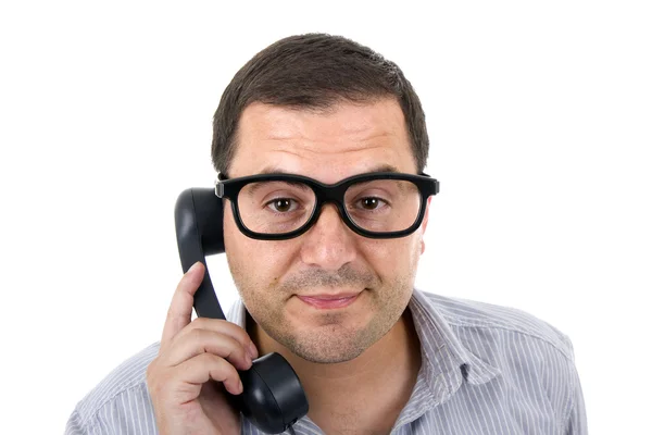 Young man with a phone and glasses, isolated on white — Stock Photo, Image