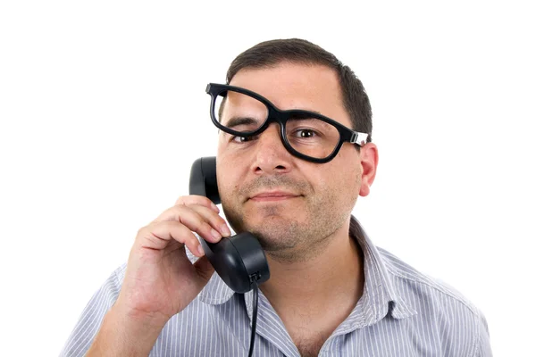 Young man with a phone and glasses, isolated on white — Stock Photo, Image