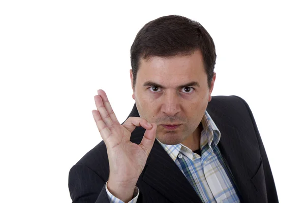 Businessman smiling doing the ok sign over a white background — Stock Photo, Image