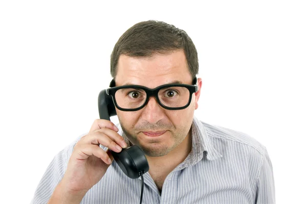 Jeune homme avec un téléphone et des lunettes, isolé sur blanc — Photo