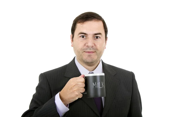 Joven hombre de negocios con una taza de leche, aislado en blanco — Foto de Stock
