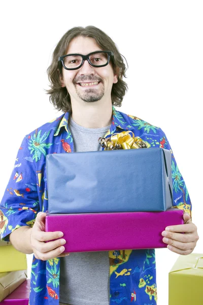 Young casual man holding gifts, isolated — Stock Photo, Image