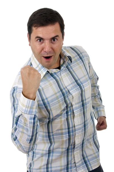 Portrait of young man winner gesture against a white background — Stock Photo, Image