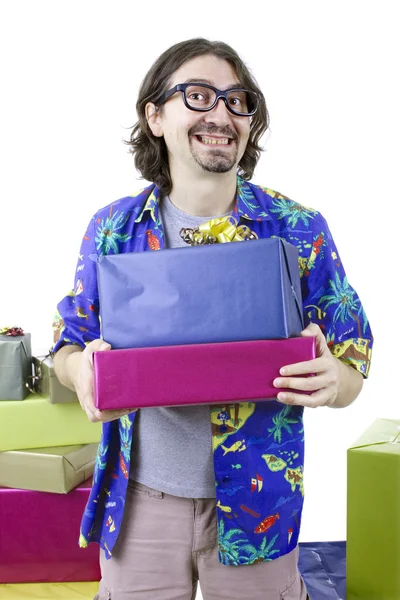 Young casual man holding gifts, isolated — Stock Photo, Image