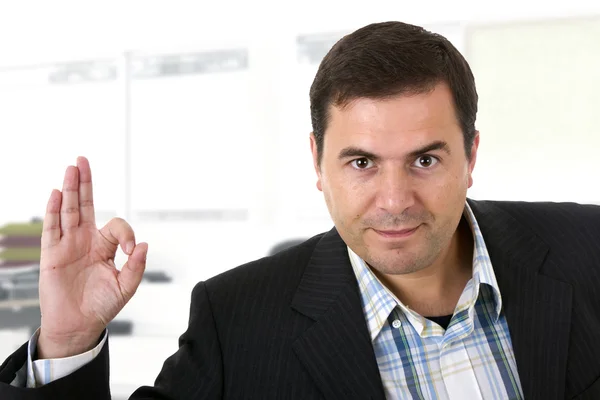Businessman smiling doing the ok sign in office — Stock Photo, Image