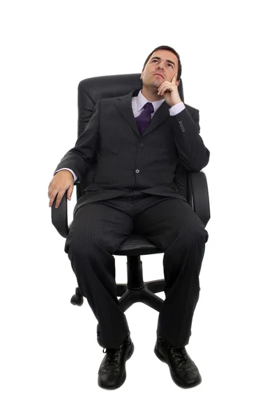 Business man sitting on a chair over white background — Stock Photo, Image