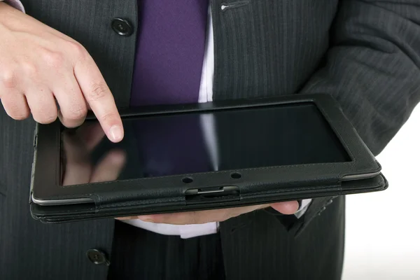 Uomo d'affari con touch pad, colpo da vicino, isolato — Foto Stock