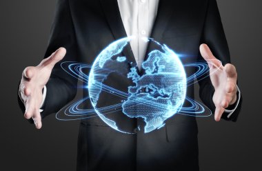 Businessman holding holographic globe clipart