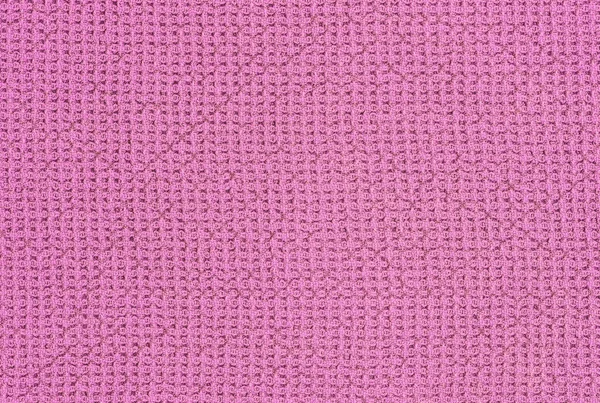Розовый вязаный текстурированный фон — стоковое фото