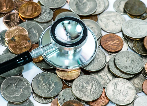 Stethoscope on currency coin for financial examination healthy c — Stock Photo, Image