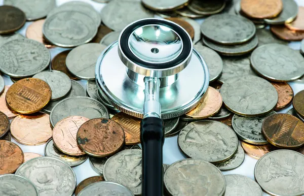 Stethoscope on currency coin for financial examination healthy c — Stock Photo, Image