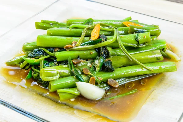 Mescolare gli spinaci fritti, cibo tailandese Immagine Stock
