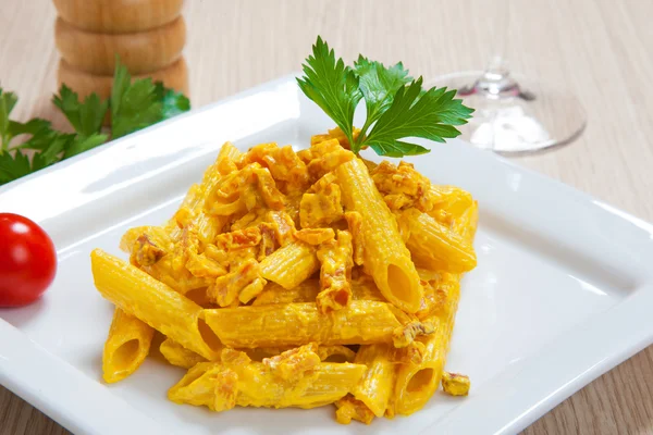 Penne with speck and saffron — Stock Photo, Image