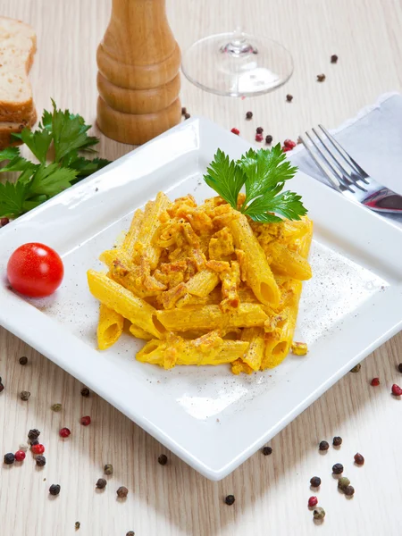 Penne with speck and saffron — Stock Photo, Image