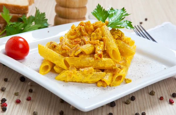 Penne with speck and saffron — Stock Photo, Image