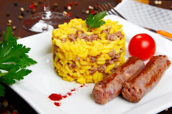 Risotto with sausages and saffron — Stock Photo, Image