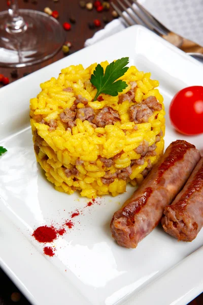 Risotto with sausages and saffron — Stock Photo, Image