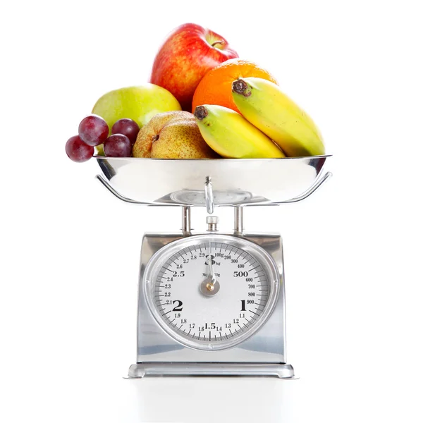 Produtos hortícolas e frutas numa balança de pesagem Fotografia De Stock