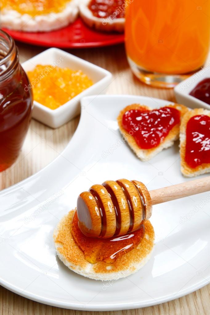 waffle with honey and jam on a dish