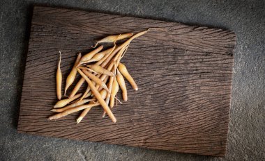 Kaempfer ginger root the herbs for Thai food ingredients and medical researching for treat and anti-covid-19, Thai herbs top view on a wooden plate background with copy space