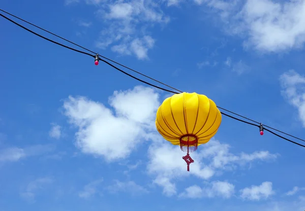 Yellow chinese lantern in a sunny day — Stock Photo, Image