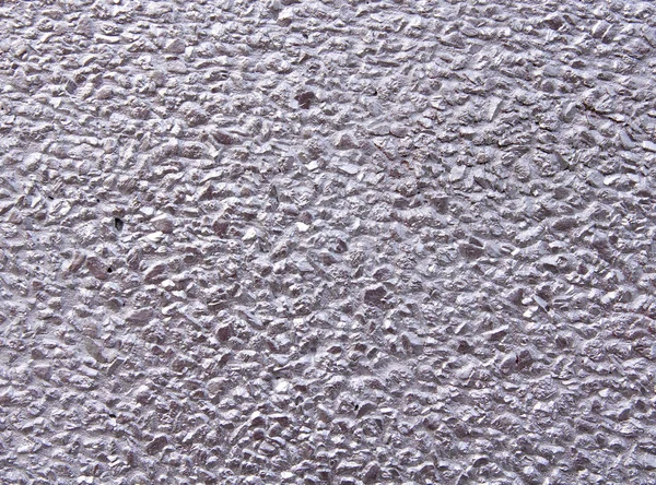 Розовая грубая мозаика на стене — стоковое фото