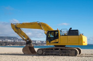 Sürüngen Kazıcıları ve güneşli havalarda kazı kovaları