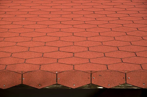 Roof New Red Bitumen Shingles Closeup — стоковое фото