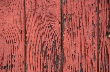 Old red cracked wooden wall closeu