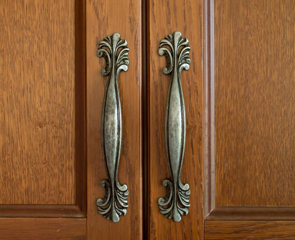 Two Decorative Verticalmetal Handles Brown Cabinet Doors Close — Stock Photo, Image