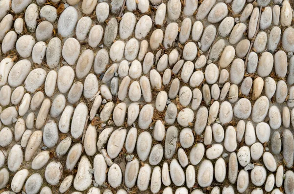 Rounded river stones used for paving the alley closeu