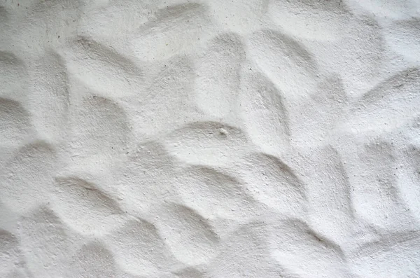 White relief plaster on wall close u