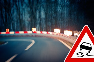Night driving - caution - curvy road clipart