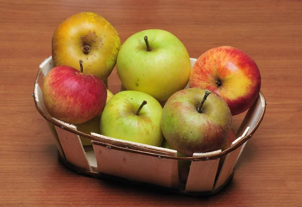 Basket with several kinds of apples — Stock Photo, Image