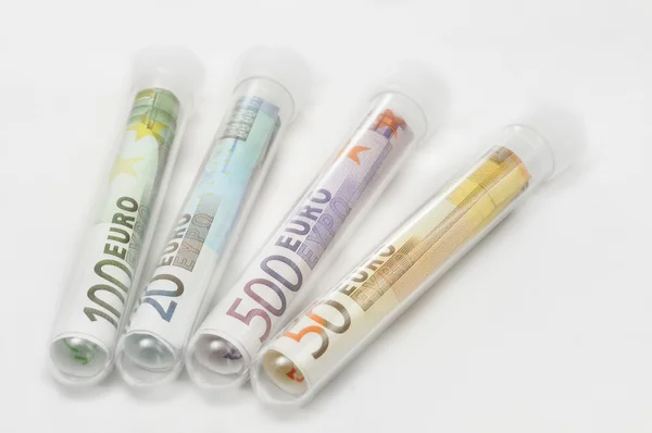Notas de euro em tubos de ensaio — Fotografia de Stock