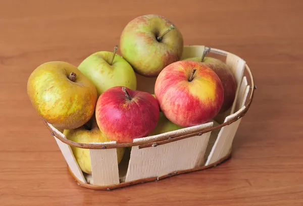 Basket with several kinds of apples — Stock Photo, Image