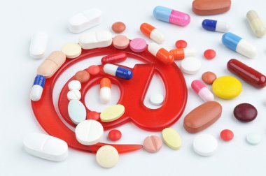 Pills with email symbol clipart