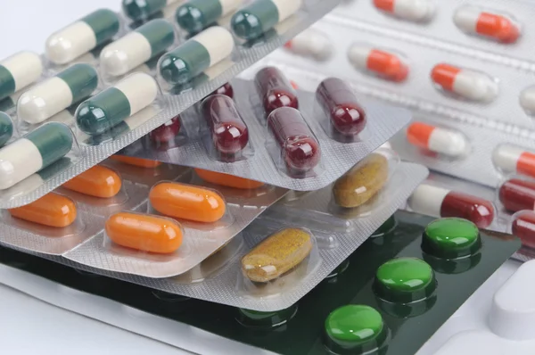 Pills and capsules in blister — Stock Photo, Image