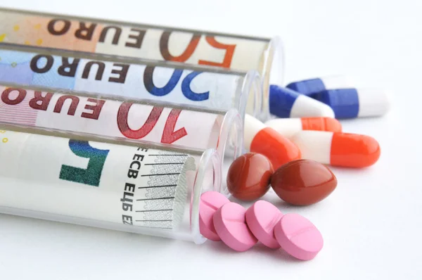 Medical pills in euro banknotes — Stock Photo, Image