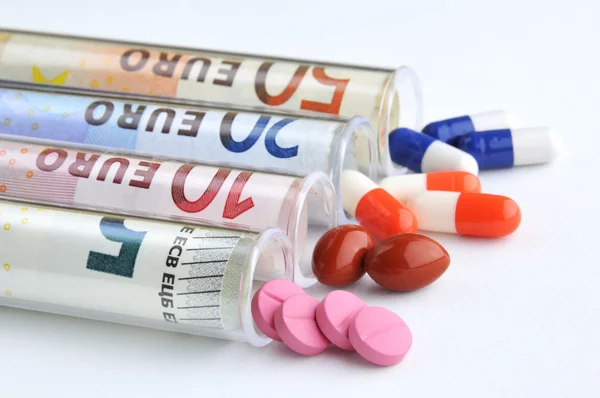 Medical pills in euro banknotes — Stock Photo, Image