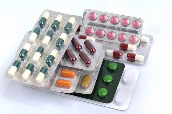 Pills and capsules in blister — Stock Photo, Image