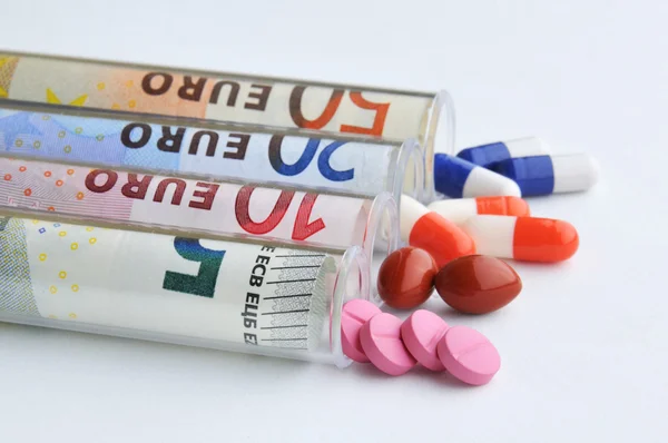 Medical pills in euro banknotes — Stock Photo, Image