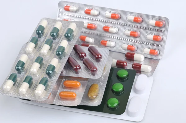 Pills and capsules in blister — Stock Photo, Image