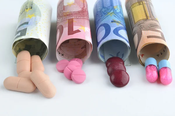 Medical pills in euro banknotes — Stock Photo, Image