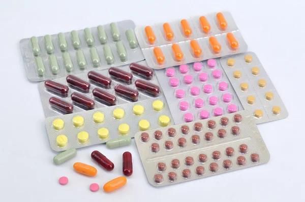 Pills and capsules in blister — Stock Photo, Image