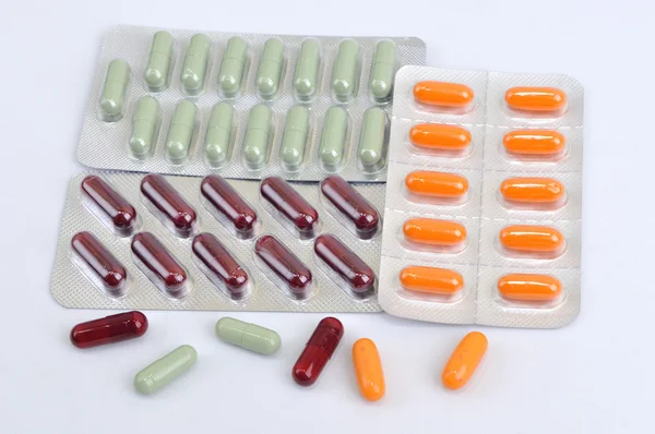 Pills and capsules in blister — Stock Photo, Image