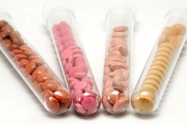 Test tubes with pills and drugs — Stock Photo, Image