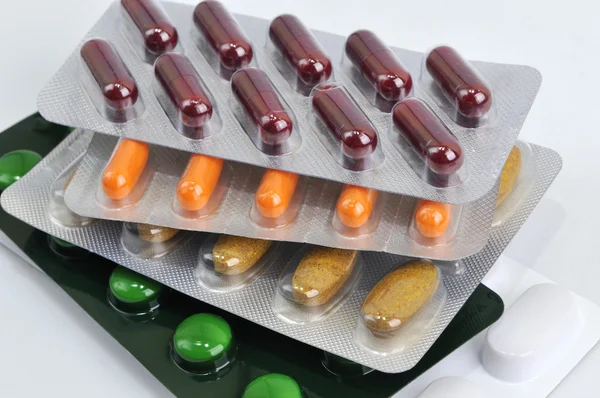 Pills and capsules in blister — Stock Photo, Image