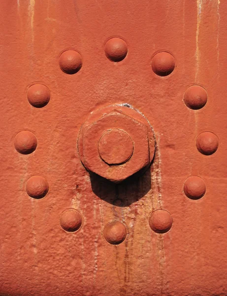 Fundo Textura maquinaria industrial pintada em vermelho com ferro — Fotografia de Stock