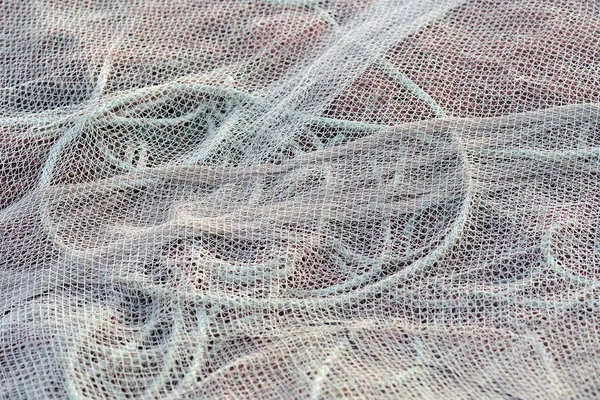 Knotted nylon net fishing and patter — Stock Photo, Image